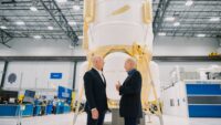 Jeff Bezos and NASA Administrator Bill Nelson chat in front of Blue Origin's Blue Moon lunar lander at the company's Alabama production facility